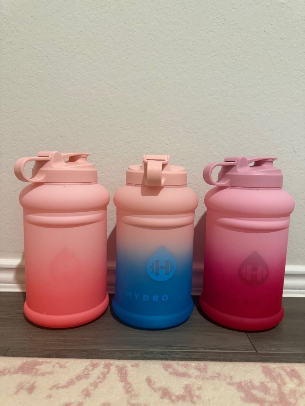 Three HydroJug Ombré Collection 64 oz Jugs